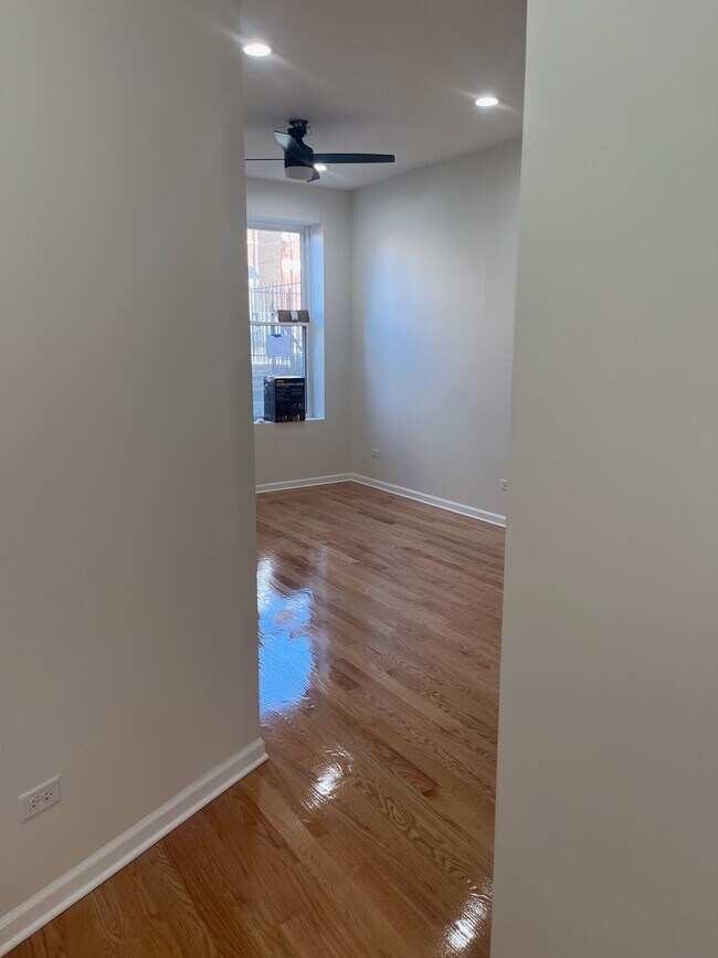 Livingroom space with brand new hardwood floors - 2141 W Coulter St