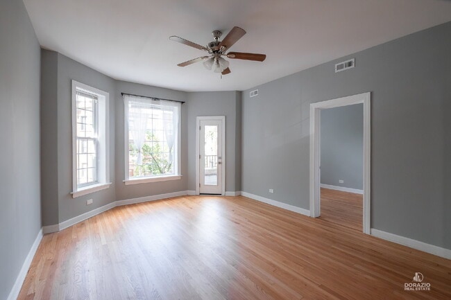 Building Photo - Modern 4BR Apartment with Hardwood Floors, Balcony & Central A/C