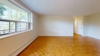Located at 32 Clayland Dr in Toronto's M3A neighbourhood, this well-laid-out one-bedroom, one-bathroom unit offers a comfortable and functional living space across a single floor. Classic parquet wood flooring runs throughout, lending warmth and character to every room.

The spacious living room is bathed in natural light through large windows that frame pleasant views of surrounding trees, creating a calm and inviting atmosphere. A baseboard heating system ensures year-round comfort. The space flows into a hallway that connects all principal rooms efficiently.

The generously sized primary bedroom features its own window with serene treetop views, parquet flooring, and ample room for furnishings. It is one of the most notable areas of the unit, offering a quiet and private retreat.

The kitchen is finished in crisp white cabinetry with abundant upper and lower storage, a marble-patterned countertop, and full-size appliances including a refrigerator — functional and clean in design.

The bathroom is finished with classic white subway tile surrounding a full bathtub and shower combination, maintaining a bright and tidy aesthetic.

A private balcony extends the living space outdoors, ideal for enjoying fresh air. The unit's clean, neutral palette and natural materials make it a versatile and welcoming home in Toronto.
