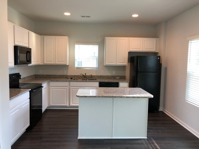 Kitchen with microwave, stove top, oven, refrigerator, dishwasher, island - 40 Great Bend Dr