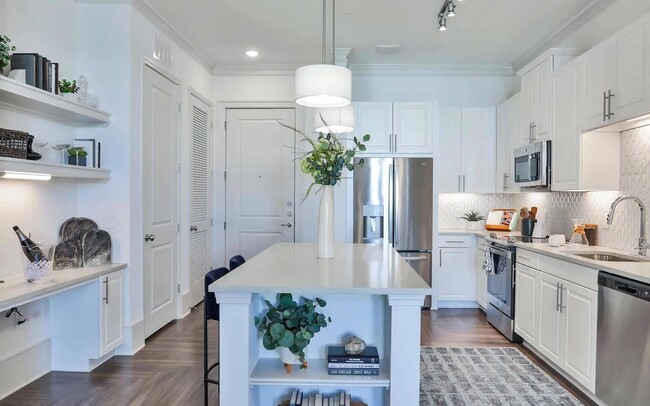 Apartment Kitchen with Island Storage, Shelves, and Stainless Steel Appliances - The Lights at Northwinds