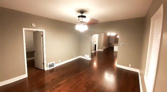 Living room with Dark walnut hard wood flooring - 4343 Grover Ave