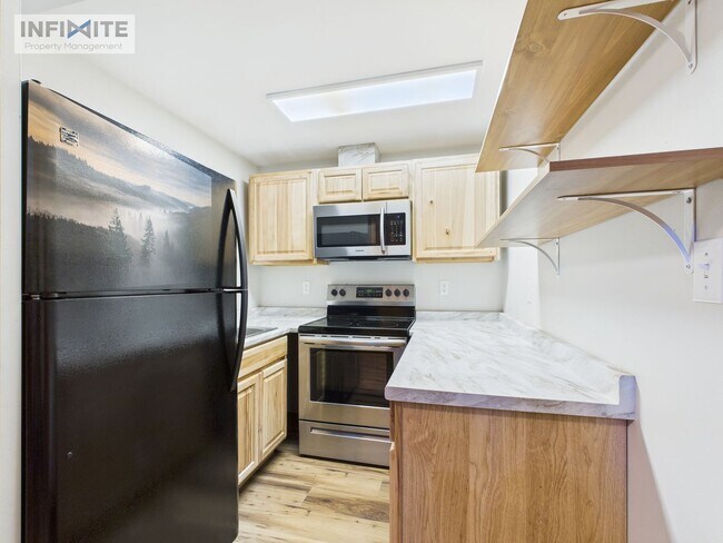 Foto del edificio - Spacious 4-Bedroom Apartment Just 4 Blocks from MSU!