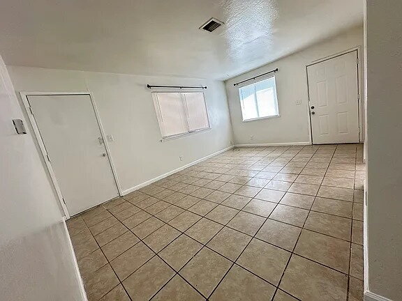 Building Photo - Fresh interior paint, new lighting fixtures, large living room, hall with laundry hook ups.