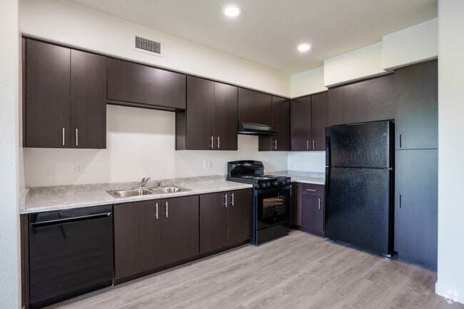 3BR, 2BA - 1,090SF - C2 - Kitchen - Serra Apartments