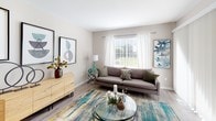Located at 1900 Windsong Dr in Schaumburg, Illinois, this single-floor residence offers a thoughtfully designed layout that balances comfort and modern style throughout. The living room serves as a welcoming centerpiece, featuring light wood-tone flooring, neutral walls, and a large window dressed with sheer white curtains and blinds that invite an abundance of natural light and views of the surrounding greenery. The dining area, positioned adjacent to the living space, benefits from oversized windows on two sides, creating a bright and airy atmosphere ideal for everyday dining. The kitchen is well-equipped with crisp white shaker-style cabinetry, light countertops, and black appliances including a gas range, microwave, and refrigerator, all set over durable wood-look flooring. The primary bedroom is generously proportioned with plush carpeting, a large window, and a walk-in closet offering ample storage. A second bedroom provides flexible use as a guest room or home office, also featuring carpeted floors and a bright window. Two bathrooms are finished with white vanities, light countertops, tiled tub-shower combinations, and wood-look flooring, maintaining a clean, cohesive aesthetic throughout. The overall ambiance is modern, bright, and move-in ready.