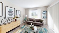 Located at 1900 Windsong Dr in Schaumburg, Illinois, this single-floor residence offers a thoughtfully designed layout that balances comfort and modern style throughout. The living room serves as a welcoming centerpiece, featuring light wood-tone flooring, neutral walls, and a large window dressed with sheer white curtains and blinds that invite an abundance of natural light and views of the surrounding greenery. The dining area, positioned adjacent to the living space, benefits from oversized windows on two sides, creating a bright and airy atmosphere ideal for everyday dining. The kitchen is well-equipped with crisp white shaker-style cabinetry, light countertops, and black appliances including a gas range, microwave, and refrigerator, all set over durable wood-look flooring. The primary bedroom is generously proportioned with plush carpeting, a large window, and a walk-in closet offering ample storage. A second bedroom provides flexible use as a guest room or home office, also featuring carpeted floors and a bright window. Two bathrooms are finished with white vanities, light countertops, tiled tub-shower combinations, and wood-look flooring, maintaining a clean, cohesive aesthetic throughout. The overall ambiance is modern, bright, and move-in ready.