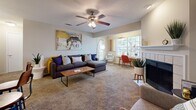 Located at 100 Riverset Lane in Memphis, Tennessee, this one-bedroom, one-bathroom residence offers a well-designed, single-floor layout with a functional and comfortable flow throughout. The living room serves as the heart of the home, featuring plush carpeting, a ceiling fan with light fixture, and a tiled wood-burning fireplace that adds warmth and character. Large windows invite natural light and provide pleasant outdoor views, creating an open and airy atmosphere. The galley-style kitchen is thoughtfully equipped with dark espresso cabinetry, light countertops, wood-look flooring, and black appliances including a range, refrigerator, and dishwasher. It opens directly into a dedicated dining area, which is illuminated by a pendant light and accented by neutral tones. The carpeted bedroom is generously sized, bathed in natural light from dual windows, and includes a closet for ample storage. The full bathroom features wood-look flooring, a tub-shower combination with tile surround, a dark-cabinet vanity, and built-in shelving for added convenience. A dedicated laundry area with washer and dryer hookups and overhead shelving rounds out this well-appointed residence.
