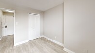 Located at 1251 King St W in Toronto's vibrant King West neighbourhood, this one-bedroom, one-bathroom unit offers a thoughtfully designed layout that maximizes every square foot. The open-concept kitchen and living area forms the heart of the space, featuring a sleek, modern kitchen outfitted with high-gloss white cabinetry, quartz countertops, a marble-style tile backsplash, stainless steel dishwasher, and ample storage. Light wood-look flooring runs throughout the main living areas, complementing the warm, neutral colour palette. The living area benefits from natural light and connects to a private balcony, offering outdoor access and views of the surrounding neighbourhood. The bedroom is a well-proportioned, quiet retreat finished with the same light hardwood flooring and neutral tones, and includes a double closet with panelled doors. The bathroom is fully updated, showcasing large-format linear tile on the walls and floors, a white vanity with clean-lined cabinetry, a combined tub and shower, and brushed nickel fixtures. Throughout the unit, crisp white trim, smooth walls, and a consistent neutral palette create a bright, cohesive, and modern aesthetic that is move-in ready.