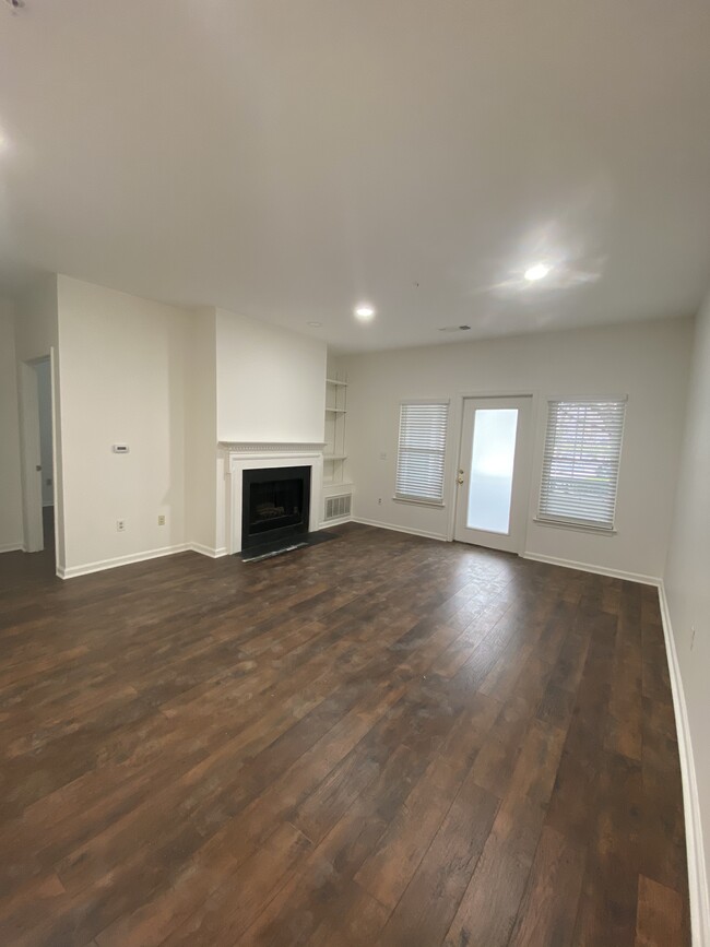Fireplace and built in bookshelf in living room - 12012 Taliesin Pl
