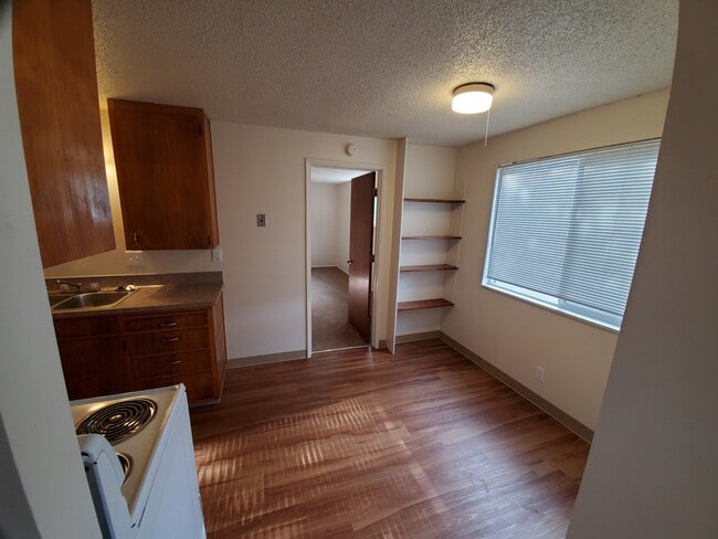 1 BEDROOM: kitchen & dining room from family room - Wolfpack Village Apartments