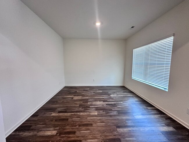 Building Photo - efficient two-level home provides a large living room, 4 very spacious bedrooms, and 2.5 bathrooms