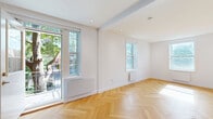 Located on Avenue Outremont in one of Montréal's most desirable neighbourhoods, this well-appointed 3-bedroom, 2-bathroom unit offers a thoughtfully designed single-floor layout with a clean, modern aesthetic throughout. Elegant herringbone-patterned hardwood flooring flows seamlessly across every room, lending warmth and visual continuity to the entire space. Crisp white walls and recessed lighting create a bright, airy atmosphere enhanced by natural light streaming through multiple windows. The bedrooms are well-proportioned, each featuring herringbone floors, windows overlooking the surrounding greenery, and built-in or sliding storage solutions. The primary bedroom benefits from multiple windows, flooding the room with sunlight. The two bathrooms are finished to a contemporary standard: one features a glass-enclosed walk-in shower with subway-style tiling and a floating vanity, while the second includes a soaking tub with glass enclosure and matching modern fixtures. The hallway connects the rooms efficiently, maintaining an open sense of flow. A balcony offers charming views of the tree-lined street below, framed by the classic brick architecture characteristic of Outremont. The unit combines refined finishes with functional design in a coveted Montréal location.