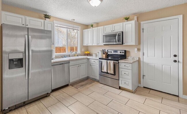 Building Photo - Charming 4 Bed, 2 Bath Home Near Peterson ...