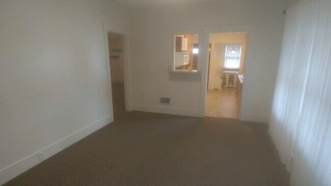part of Living room facing kitchen - 5031 11th Ave NE