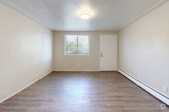 2BR, 2BA - 750SF - Living Room - Alpine Flats