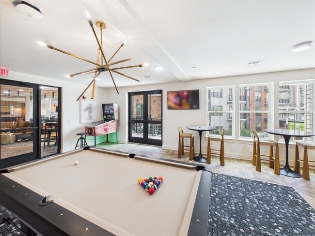 Dugout Den with pool table, tvs, and hundreds of pinball games - Yardley Flats Apartments