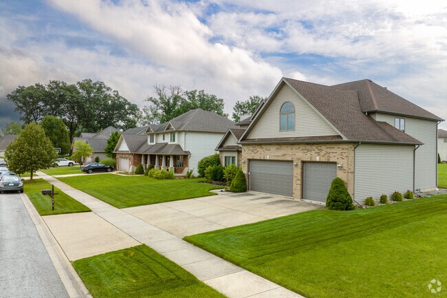 Pitched roofs, two and three car garages homes of New Elliott, Schererville, IN.