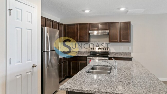 Building Photo - 1,287 sqft of Open concept living in Palm ...