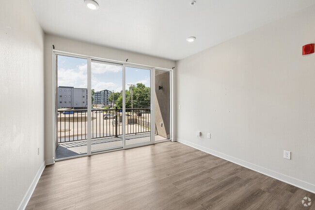 4BR, 2BA - 1,442SF - Living Room - 12b Lofts & Avenue M
