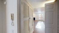Located at 350 Resler Dr in El Paso, TX, this single-story 2-bedroom, 1-bathroom home offers a well-organized layout with a comfortable, functional design. The living room serves as the heart of the home, featuring rich wood-look flooring, a ceiling fan, a cozy fireplace with a tile hearth, and a sliding glass door that fills the space with natural light and provides outdoor access. A side window adds additional brightness, creating an open and airy atmosphere.

The galley-style kitchen is efficiently designed with taupe cabinetry lining both walls, light stone countertops, a gas range, dishwasher, and a refrigerator. A door at the end of the kitchen leads to a dedicated storage closet with built-in shelving, adding practical utility to the space.

Both bedrooms are carpeted and include ceiling fans and windows that invite natural light. The primary bedroom offers generous proportions, while the second bedroom provides comfortable accommodations. A hallway with louvered bi-fold closet doors connects the main living areas to the private spaces. The bathroom features a full tub-shower combination with large marble-style white tiles and brushed nickel fixtures, complemented by wood-look flooring.