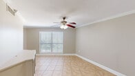 Located at 1925 N Third St in Baton Rouge, Louisiana, this single-floor, 3-bedroom, 2-bathroom home offers a functional and well-maintained layout. The living area features neutral beige walls, light ceramic tile flooring, crown molding, and a ceiling fan with light fixture, complemented by a window with blinds that invites natural light into the space. The kitchen is equipped with rich wood cabinetry, a tiled backsplash, black appliances including a refrigerator, dishwasher, and range, along with a double sink and ample counter space. The spacious primary bedroom features warm hardwood flooring, two windows offering outdoor views, and a ceiling fan. The additional bedrooms also feature hardwood floors, ceiling fans, and built-in closets with bifold doors. The two bathrooms are finished in neutral tones with tile flooring; the larger bathroom includes a vanity with a wide mirror, built-in cabinetry, and a tiled shower, while the second bathroom features a corner vanity with a medicine cabinet. A connecting hallway ties the layout together efficiently. Throughout the home, consistent neutral paint tones and clean finishes create a cohesive and inviting atmosphere.
