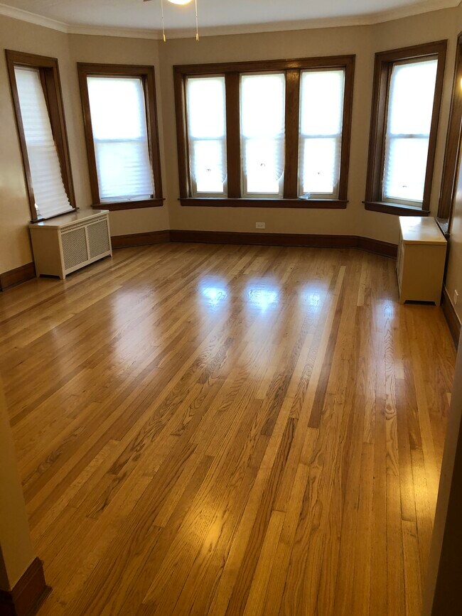 living room newly refinished hardwood floors - 1648 N Nagle Ave