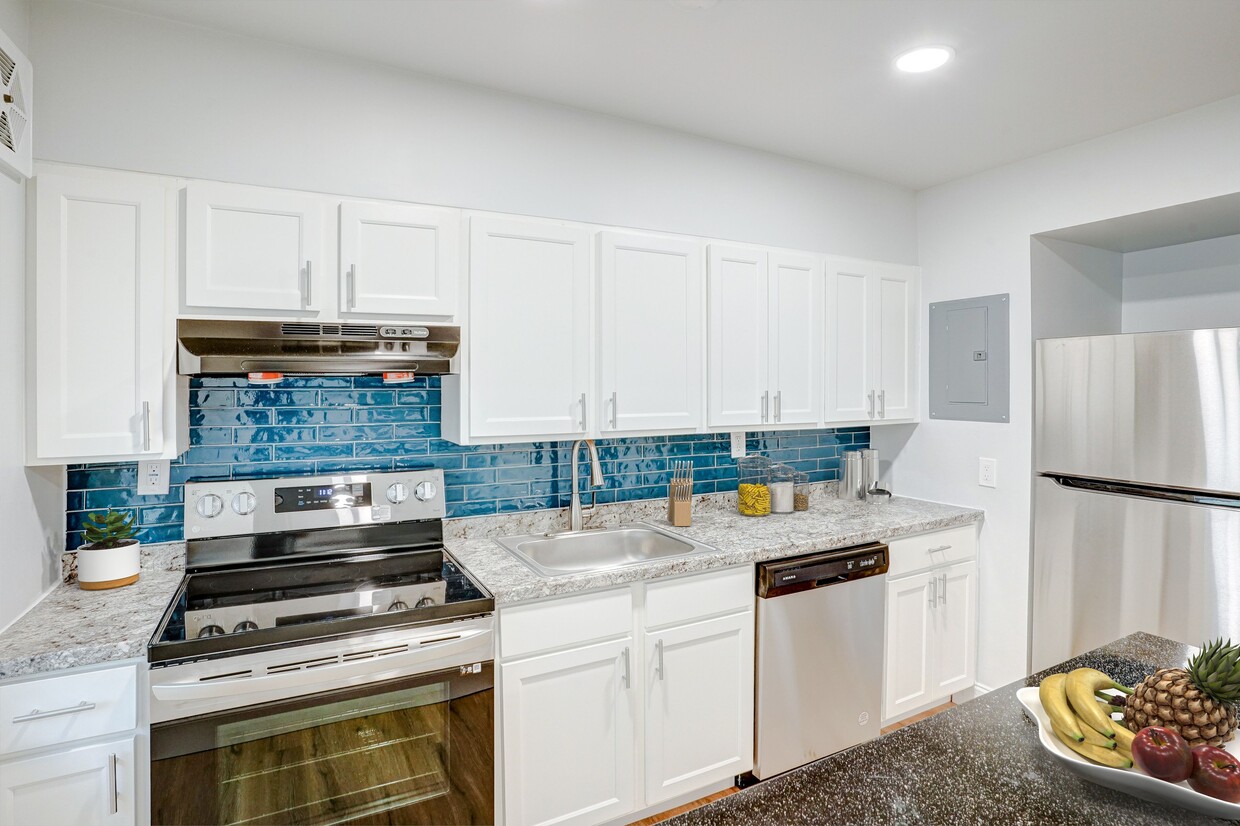 Kitchen-Renovated - Greens At Forest Park Apartments