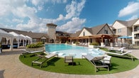This residential community is designed with outdoor living at its core, offering a collection of thoughtfully landscaped amenity spaces that cater to relaxation and social interaction. The centerpiece is a generously sized resort-style swimming pool with a freeform design, surrounded by manicured turf, paved pool decking, and an ample supply of modern lounge chairs — ideal for sunbathing and leisure. A wood-framed pergola provides shaded poolside seating, adding architectural character to the outdoor environment.

Adjacent to the pool area is a covered outdoor pavilion featuring exposed heavy timber beams, built-in grilling stations, ceiling fans, and multiple dining and seating arrangements. A mounted flat-screen television makes this space equally suited for casual entertaining and everyday outdoor dining. Stone columns and decorative fencing provide structure and definition to the area.

The surrounding courtyard spaces are characterized by rich red brick architecture with multi-story residential buildings, mature shade trees, manicured shrubs, and brick-paved walkways. Umbrella-shaded seating areas are scattered throughout, encouraging communal outdoor use. Well-maintained landscaping with ground cover plantings and seasonal greenery contributes to the community's inviting, park-like atmosphere throughout.