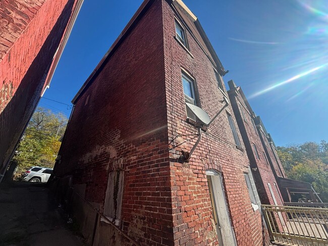 Building Photo - Updated flooring, finished basement, and great outdoor space in a walkable Swissvale location