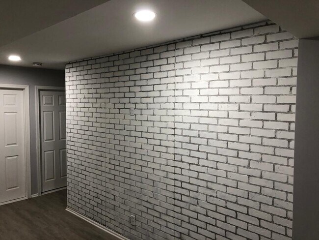 accent brick wall in living room - 214 Elm St