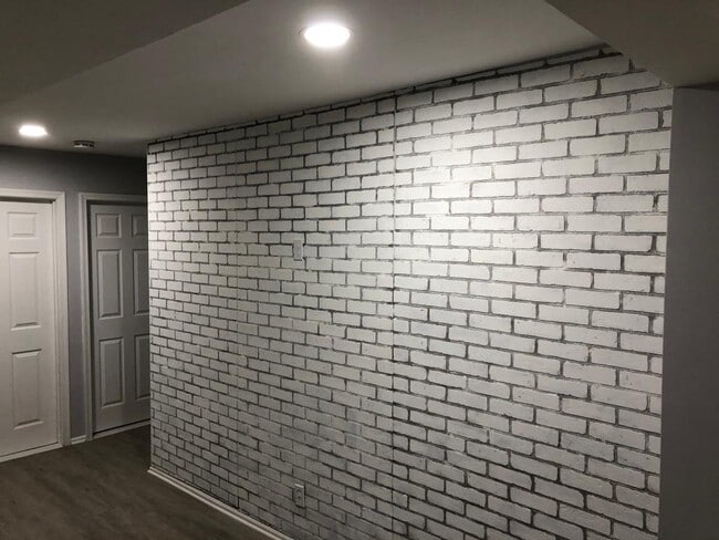 accent brick wall in living room - 214 Elm St