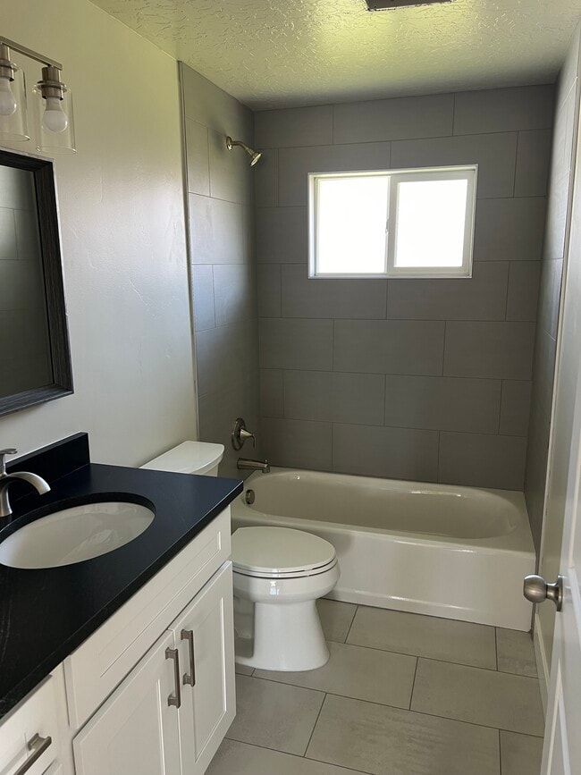 Brand new bathroom with granite countertops and soaker tub - 7353 S Rusty Dr