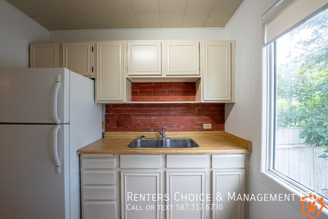 Building Photo - Main Floor Suite with No Yard Care Duties,...
