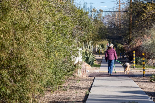 Residents are enjoying a quiet stroll in Broadmoor-Broadway, Tucson, AZ.