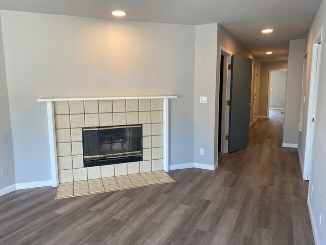 living room with fireplace - 3675 Mission St