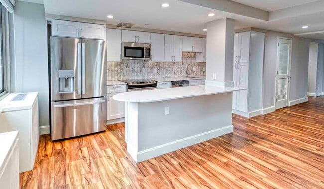 Modern kitchen with stainless steel appliances - The Sterling Apartment Homes