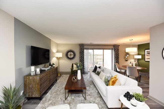 Spacious living room with hardwood-style flooring - Edison at Meridian Hills