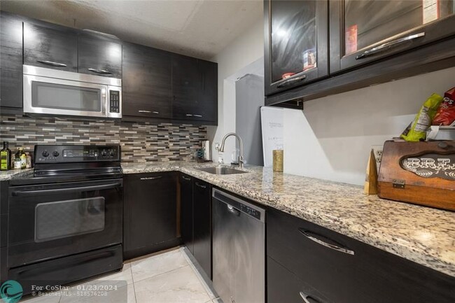 Building Photo - 7410 Woodmont Terrace