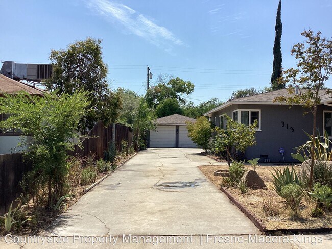 Building Photo - 3 br, 2 bath House - 313 W. Robinson Avenue