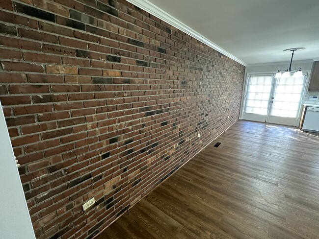 Living roo/ Exposed Brick wall - 2810 Falcon Ln