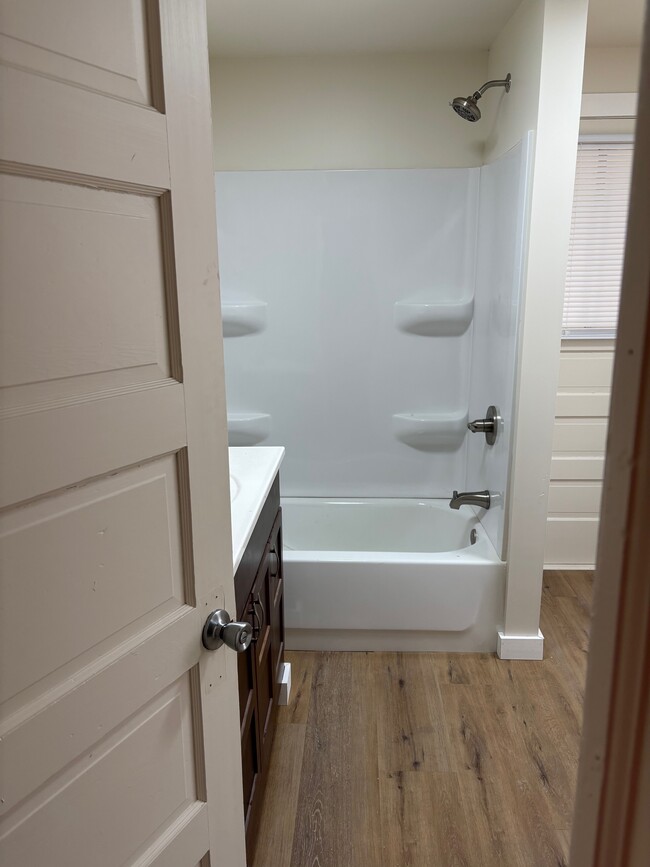 Large, newly renovated bathroom with cherry wood & tub/shower. - 144 Coolidge St