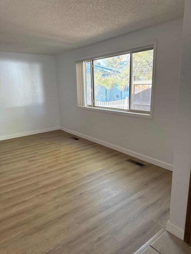 Building Photo - SE Home on Large Lot, New Luxury Vinyl Flooring & Paint, RV parking, Air Conditioning & Fenced