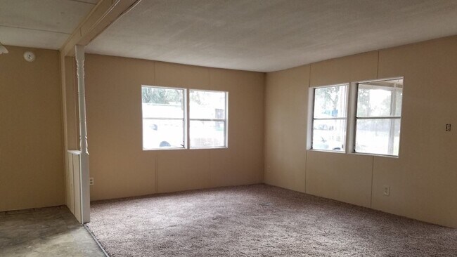 Building Photo - Freshly painted spacious 2-bedroom 1-bath home with a screened porch and storage shed.