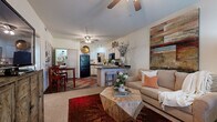 Located at 250 Bellerive Ave in Bryant, Arkansas, this 1-bedroom, 1-bathroom residence offers a thoughtfully designed single-floor layout that maximizes comfort and functionality. The open-concept living and kitchen area serves as the heart of the home, where the two spaces flow seamlessly together. The kitchen is well-appointed with white cabinetry featuring dark granite-style countertops, black appliances including a range, microwave, and refrigerator, a dishwasher, and a breakfast bar with barstool seating — ideal for casual dining. Wood-style flooring grounds the kitchen area, while ceiling fans in both the living room and kitchen area keep the space comfortable year-round. The living room is bright and inviting, with natural light streaming through large windows and a front entry door. Neutral carpet continues into the bedroom, which offers a generous layout, a ceiling fan, and a window with outdoor views. A dedicated closet provides practical storage. The bathroom features a single vanity with a framed mirror, overhead lighting, white cabinetry, and a shower-tub combination. Throughout the space, neutral wall tones and consistent finishes create a cohesive and welcoming atmosphere.