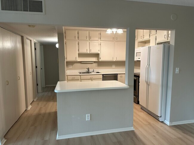 Kitchen has lots of storage and stainless-steel stove, dishwasher, and microwave. - 4075 W 51st St