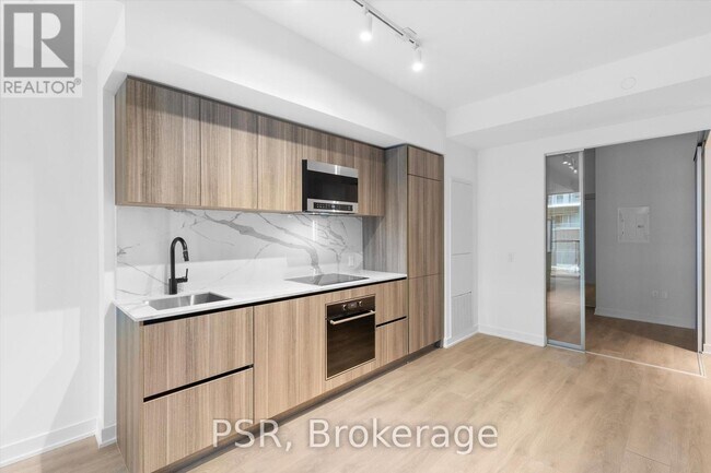 Photo du bâtiment - 117-117 Broadway Ave