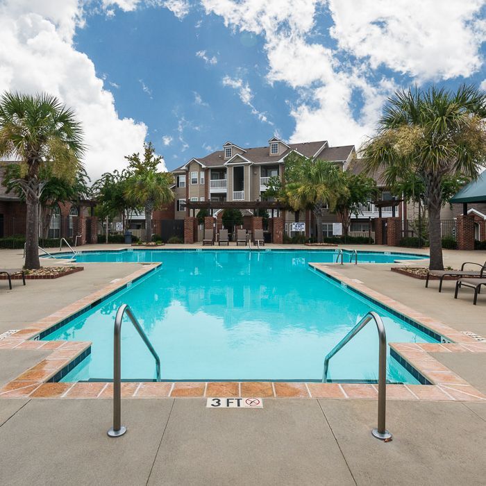 Piscina estilo centro turístico con terraza - Woodcreek Farms