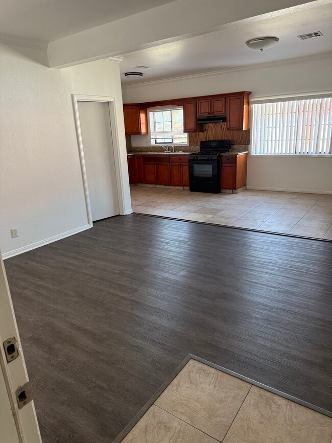 Living room with kitchen view - 1700 W 43rd St