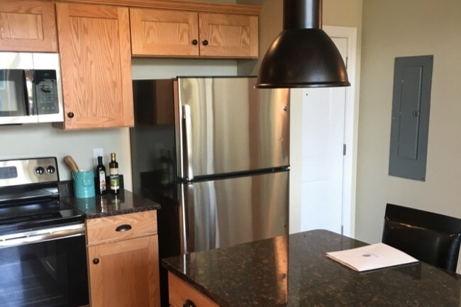 Kitchen with Island and Chairs - 80 Oak St